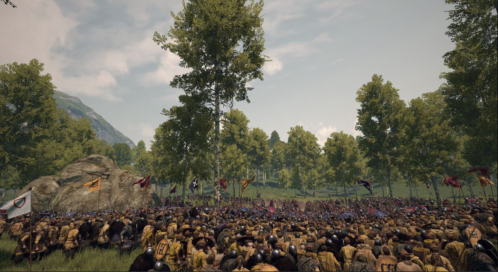 A vast battle at the edge of a wood, the lines crowded with the banners of several realms and their vassals
