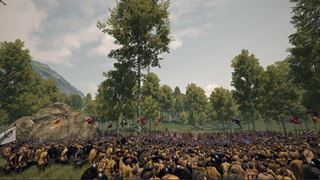 A vast battle at the edge of a wood, the lines crowded with the banners of several realms and their vassals, large and small