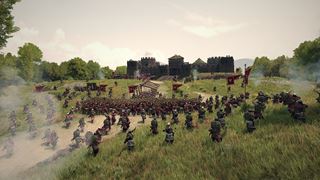 A siege assault on a stone castle, the attackers' standards up through the smoke